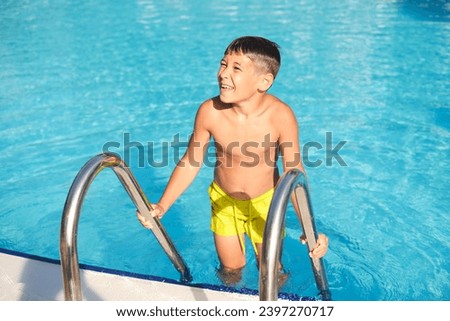 Child hoists himself from pool, laughter in the air. Emphasizes the role of physical activity in mental well-being