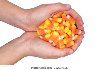 Child holding candy corn