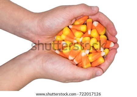 Child holding candy corn