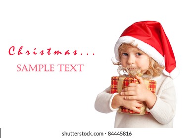 Child Holding Christmas Gift Box In Hand. Isolated On White Background