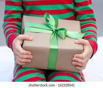 Child Holding A Christmas Present Nicely Wrapped