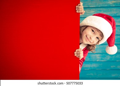 Child Holding Empty Banner. Kid Hiding Behind Card Blank. Christmas Xmas Winter Holiday Concept