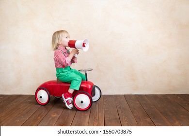 Child Holding Loudspeaker. Kid Shouting Through Vintage Megaphone. Business News Concept