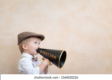 Child Holding Loudspeaker. Kid Shouting Through Vintage Megaphone. Business News Concept