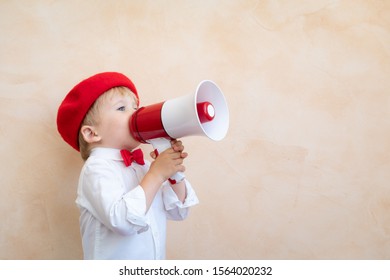 Child Holding Loudspeaker. Kid Shouting Through Vintage Megaphone. Business News Concept