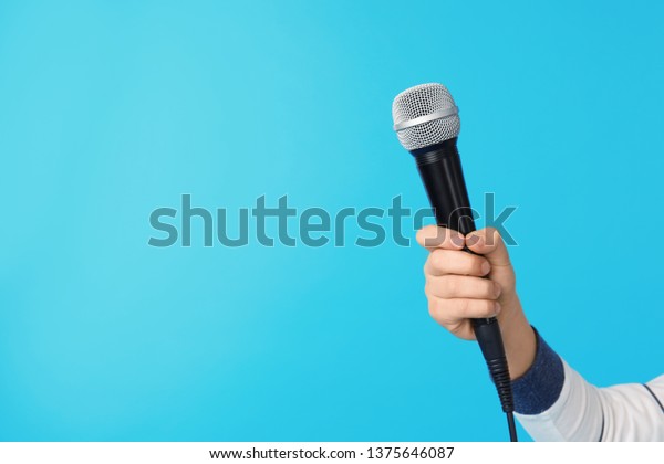 Child Holding Microphone On Color Background Stock Photo 1375646087 ...