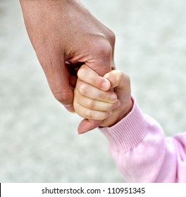 Child Holding Mother's Hand