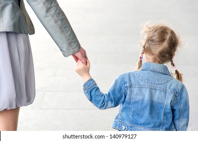 Child Holding Mother's Hand