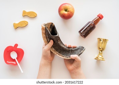 Child Holding Musical Horn Shofar For Jewish Holiday Rosh Hashanah.