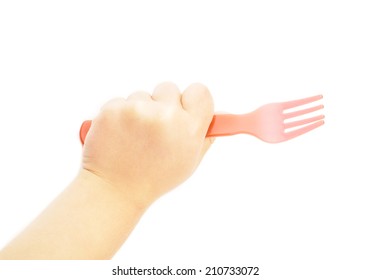 Child Holding A Red Plastic Fork Towards White