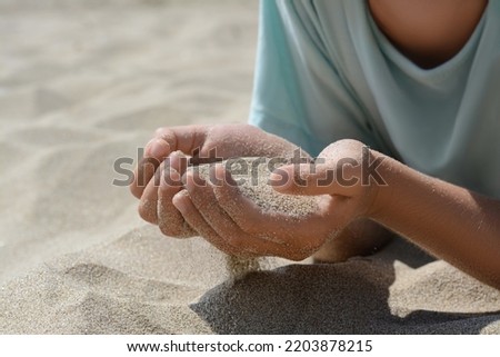 Hand im Sand Lifestyle