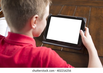 A Child Holding White Tablet PC In Hands 