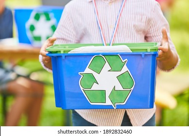 Child holds box with recycling symbol in a project for environmental protection and ecology - Shutterstock ID 1892832460