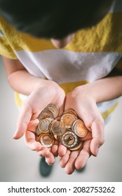 Child Holds Euro Coins In Hand