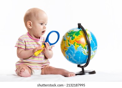 The Child Holds The Planet Earth In His Hands. War In Ukraine. Russia Terrorist. Stop War. Toy Globe In Children's Hands. Peace On Earth Concept