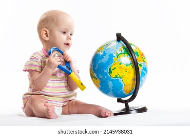 The Child Holds The Planet Earth In His Hands. War In Ukraine. Russia Terrorist. Stop War. Toy Globe In Children's Hands. Peace On Earth Concept