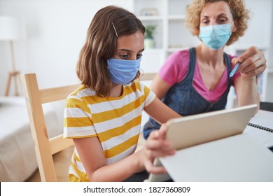 Child Home Studying Education, Homeschooling, With Private Tutor / Mother With Protective Mask In The Time Of Viruses, Flu And Seasonal Pandemic.