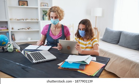 Child Home Studying Education, Homeschooling, With Private Tutor Mother In The Time Of Viruses, Flu And Seasonal Pandemic.