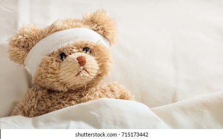 The Child Is Hurt.Teddy Bear With Bandage In The Hospital, Space For Text