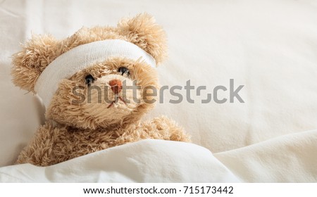 The child is hurt.Teddy bear with bandage in the hospital, space for text