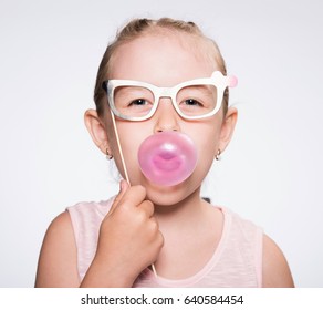 Child With Inflate The Balloon Of Bubble Gum