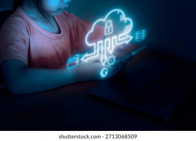 A child interacts with a tablet while seated at a desk. Surrounding the child are digital icons representing cloud technology and data. The room is dark, creating a focused atmosphere.