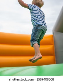 Child Jumps In Bouncy Castle