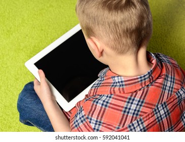 Child Keeps Tablet In Hands