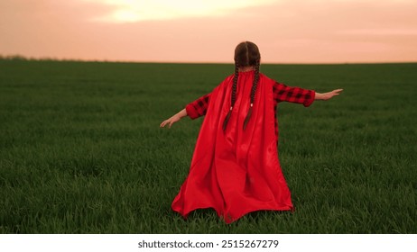 child kid baby girl runs sunset superhero costume sunset park, children dream happy kid, red cloak fantasy, playful victory, outdoor games, sunset hero, victory in field, outdoor hero, sunset - Powered by Shutterstock