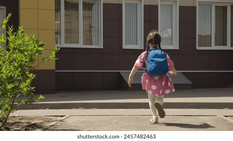 child kid girl daughter running school backpack, returning from school from lessons, children education school yard house running leg, carefree kid joy, kid enjoying outdoors, jumping child happiness - Powered by Shutterstock