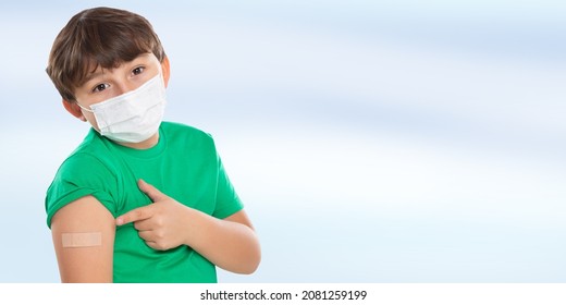 Child kid pointing on plaster after Coronavirus vaccination wearing face mask against Corona Virus COVID-19 Covid copyspace copy space latin
