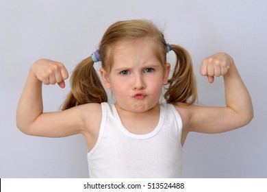 Child, Kid (the Little Girl) Shows The Biceps.