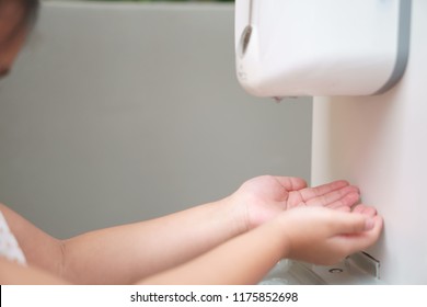 Child Or Kid Wash Hands By Hand Wash Gel Alcohol Machine Or Sanitizer For Clean And Healthy With Kill Bacteria Or Antibacterial And Coronavirus Covid-19 At Department Store Or School And Restaurant