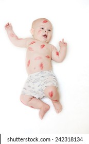 Child Kissing On A White Background Showing Middle Finger