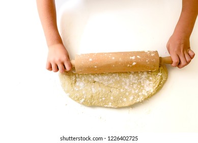 Child Kneading The Dough Of A Pizza, Viewed From Above.