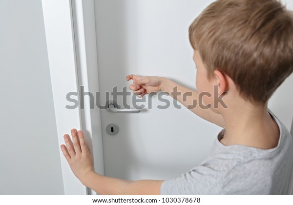 Child\
knocking on door before entering, home privacy concept. family\
behavior rules during coronavirus\
quarantine.