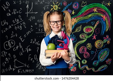 Child Learning Creativity And Mathematics, Creative School Kid Girl Student With Books Over Art Blackboard, Education Concept