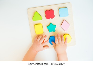 Child learning geometric shapes. Kid learning to solve problems and developing cognitive skills