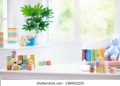 Child Learning Letters And Numbers. Kid With Colorful Wooden Abc Blocks. Little Boy Spelling Words With Educational Block Toys. Kids Doing School Homework At White Desk. Bedroom For Preschool Children