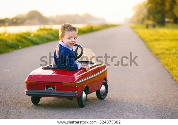 child learns to drive the\
car
