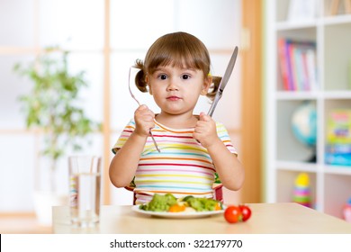 Child Little Girl With Fork And Knife Ready To Eat