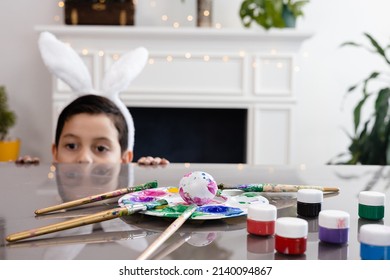 Child Look Out The Egg From Under The Table