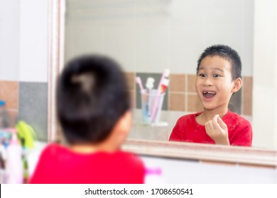 Child Looking In Mirror Mouth Of Without Anterior Milky Tooth. Toothless Smile. Child Lost Front Tooth.