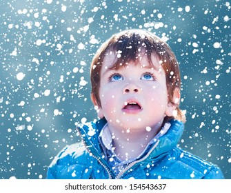 Child Looking Snow Falling With His Mouth Open