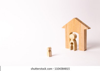 The child looks at his mother and his house before leaving. A mother with a void in the body in the form of a child is standing in the door of the house. Adoption of children. Running away from home