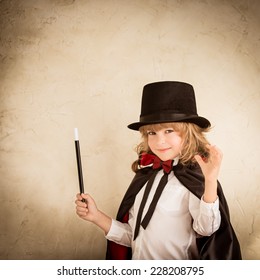 Child Magician. Kid Holding Magic Wand. Success Concept