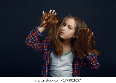 Child Makes Face Leaning Against The Glass