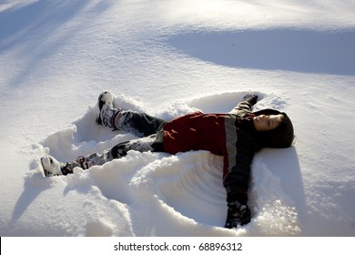 A Child Makes A Snow Angel