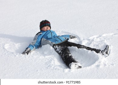 Child Makes A Snow Angel