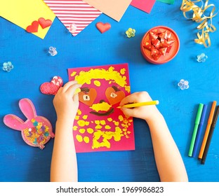 Child Making Homemade Greeting Card From Paper. Gift For Mothers Day, Fathers Day, Birthday Or Valentines Day.  Kid Craft. Home Education Game. Early Development Concept